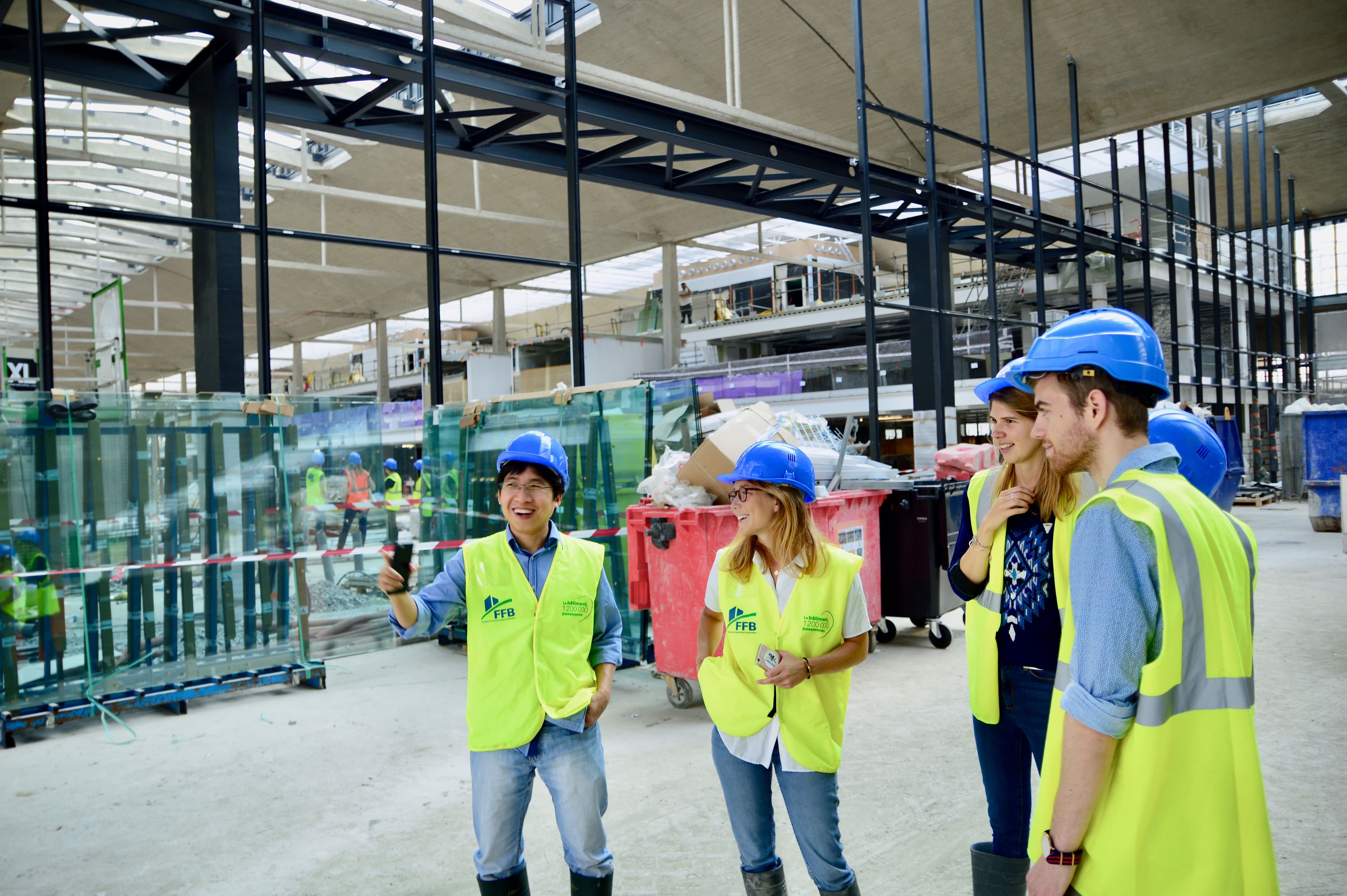 A construction team reviewing a project together on site